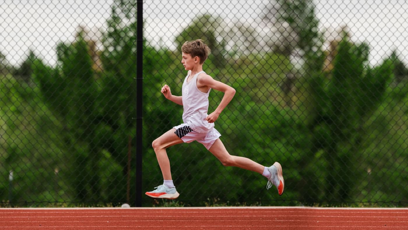 Student athlete running at track event