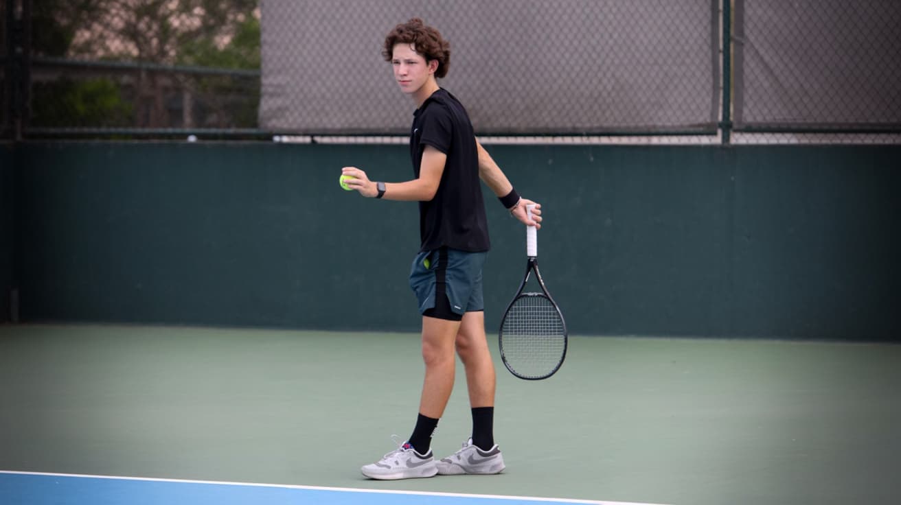 Student with laptop focusing on live class